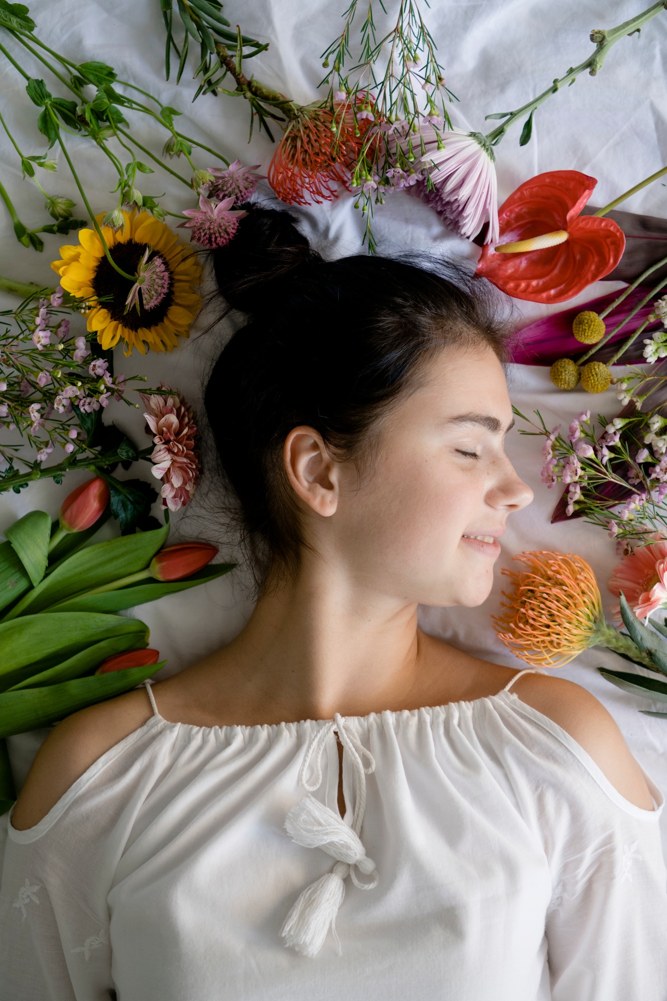 Woman lying down with flowers